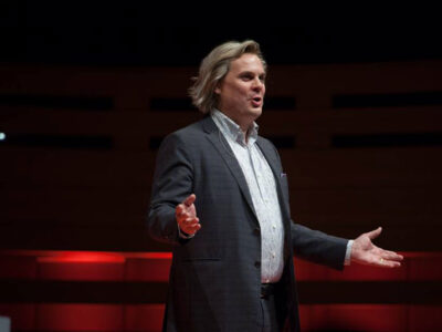 Mark Bowden speaking on a TED stage